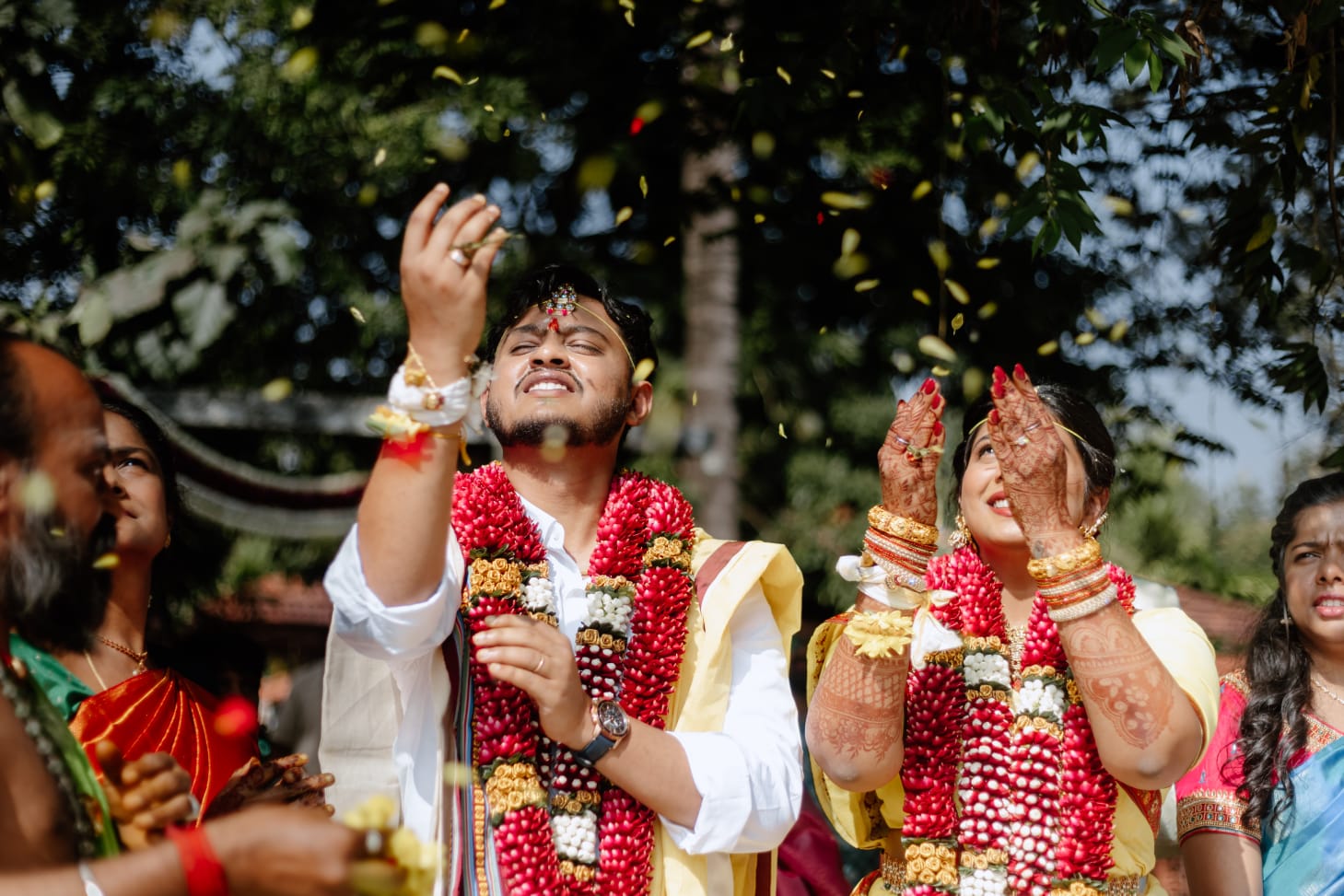 Joyful Wedding Moment with Flower Petals